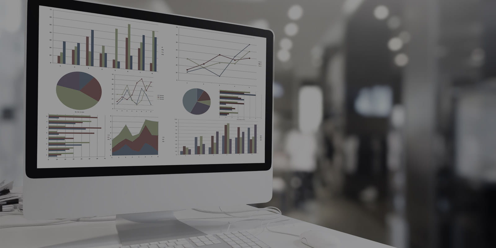 Computer screen with charts and graphs next to the VetWatch logo