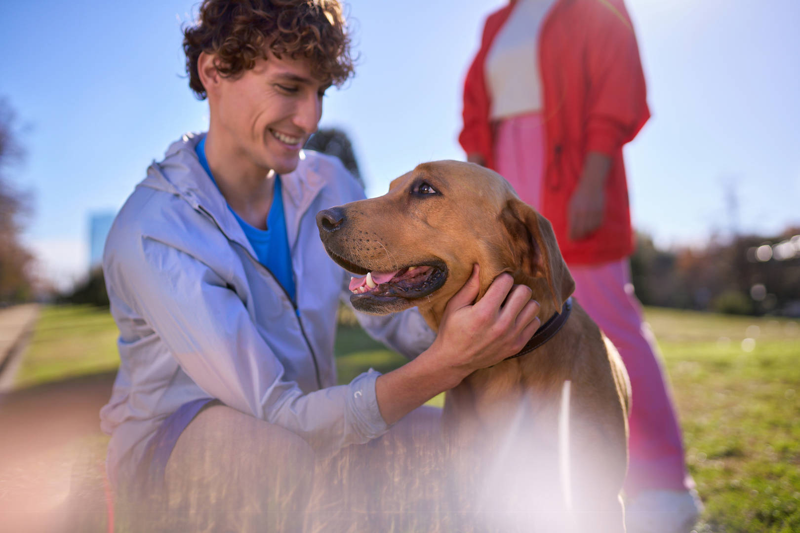 Young people in park with dog