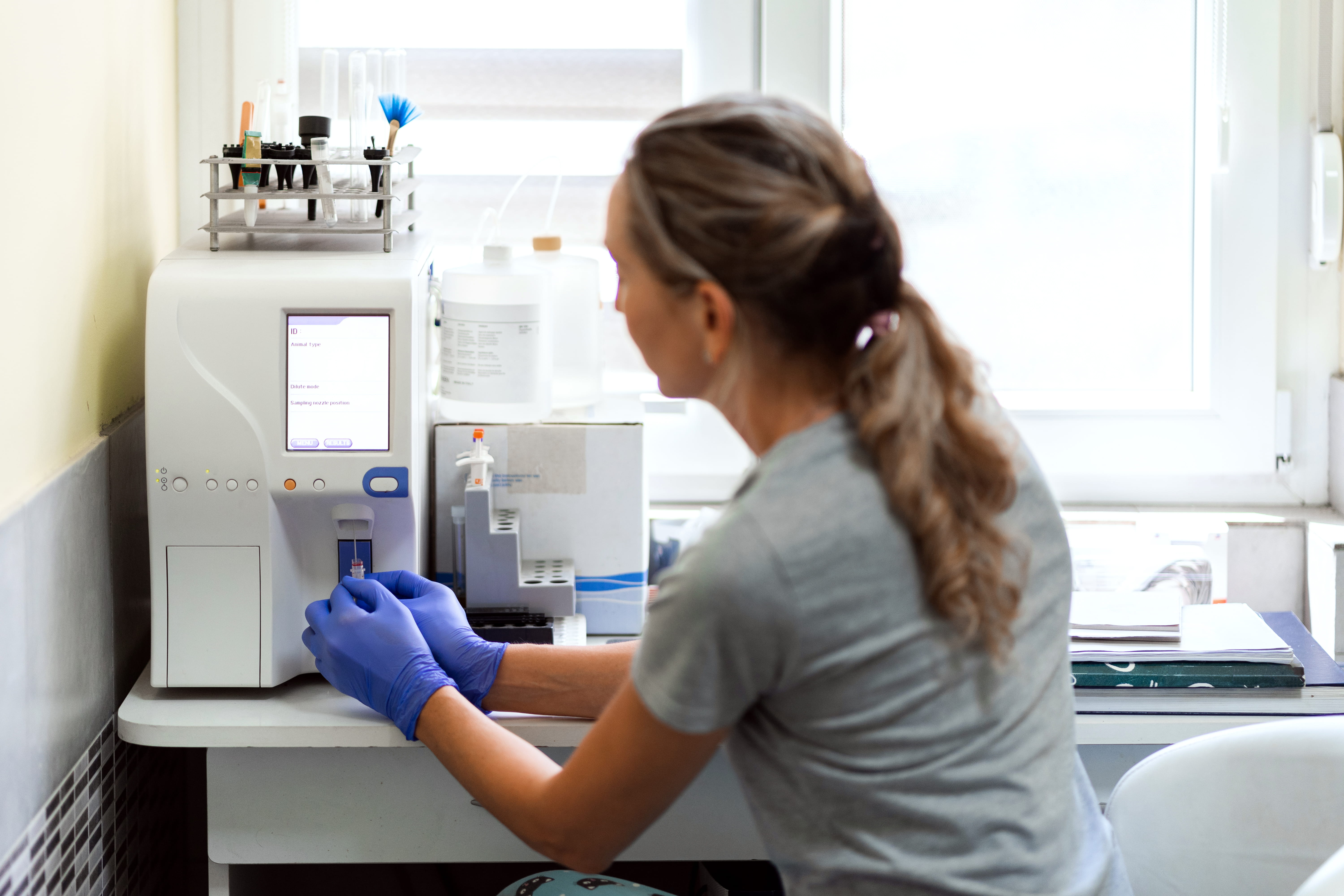 Veterinary tech works with lab equipment